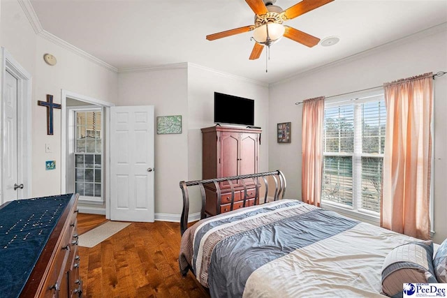 bedroom with baseboards, ceiling fan, wood finished floors, and crown molding