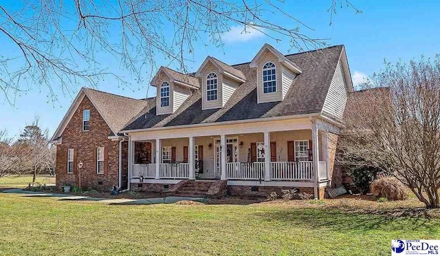 new england style home featuring a porch, crawl space, brick siding, and a front lawn