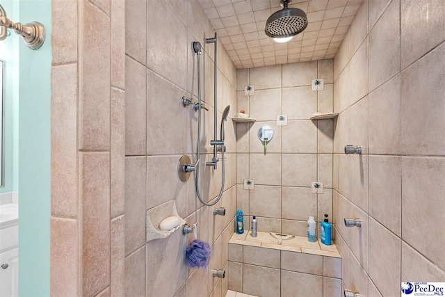 bathroom with a tile shower