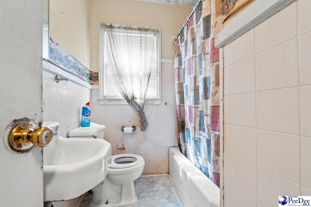 517 Alane St, Lake City, SC 29560 - full bath with tile walls, tile patterned floors, toilet, a sink, and shower / bath combination with curtain