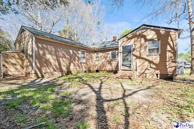 517 Alane St, Lake City, SC 29560 - back of house featuring metal roof and entry steps