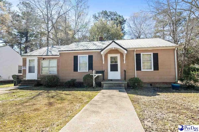 517 Alane St, Lake City, SC 29560 - view of front of house featuring metal roof, a front lawn, and crawl space