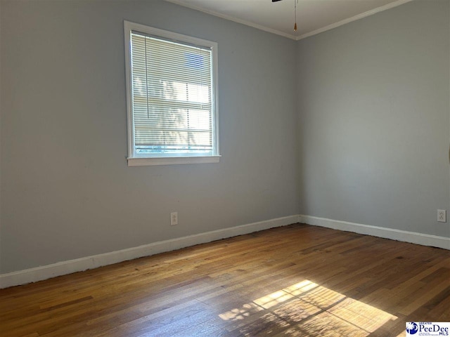 1611 S Lee Dr, Florence, SC 29501 - spare room with a ceiling fan, ornamental molding, baseboards, and wood finished floors