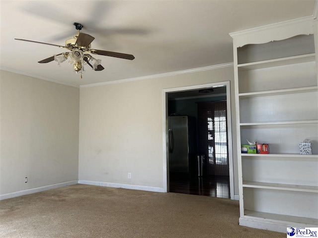 1611 S Lee Dr, Florence, SC 29501 - spare room featuring baseboards, ornamental molding, ceiling fan, and carpet