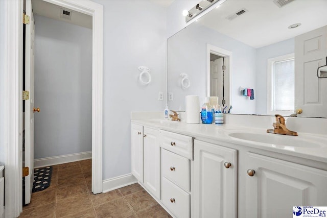 bathroom with vanity and tile patterned floors