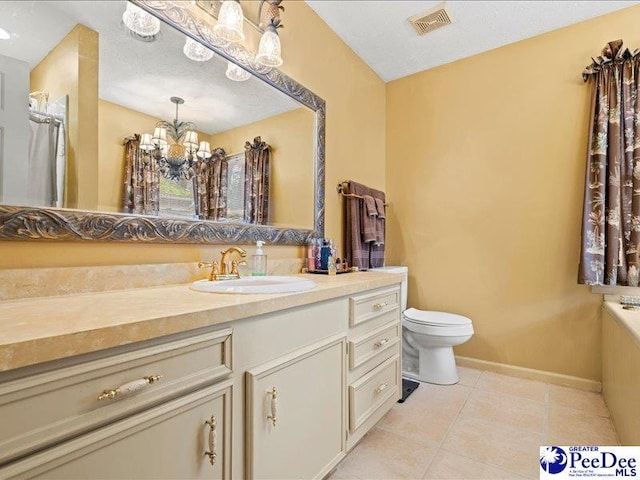 bathroom featuring vanity, toilet, a chandelier, and tile patterned flooring