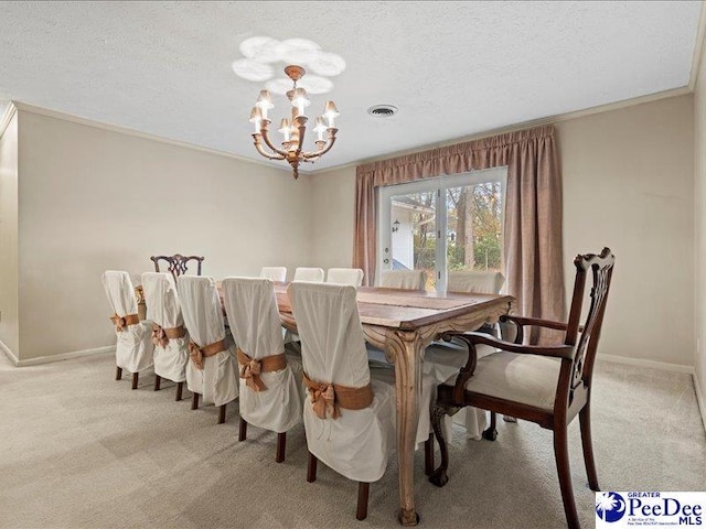 carpeted dining area with crown molding, a textured ceiling, and an inviting chandelier