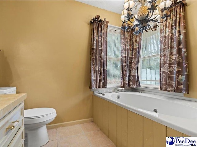 bathroom featuring a tub to relax in, tile patterned floors, vanity, and toilet