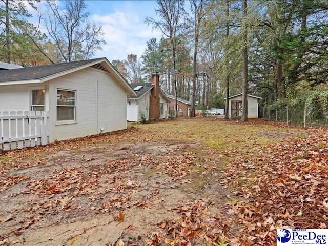 view of yard with a storage shed