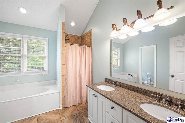 912 Ivanhoe Dr, Florence, SC 29505 - bathroom featuring vaulted ceiling, a bath, a tile shower, double vanity, and tile patterned flooring