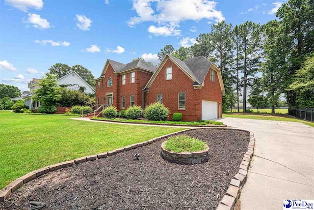 912 Ivanhoe Dr, Florence, SC 29505 - view of front of home with a garage, brick siding, and driveway