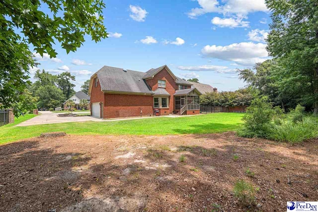 912 Ivanhoe Dr, Florence, SC 29505 - rear view of house with brick siding, a garage, and concrete driveway
