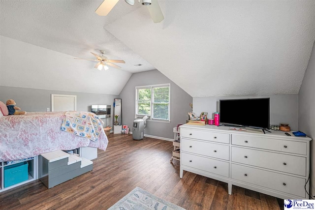 912 Ivanhoe Dr, Florence, SC 29505 - bedroom with a textured ceiling, dark wood-style flooring, vaulted ceiling, and ceiling fan
