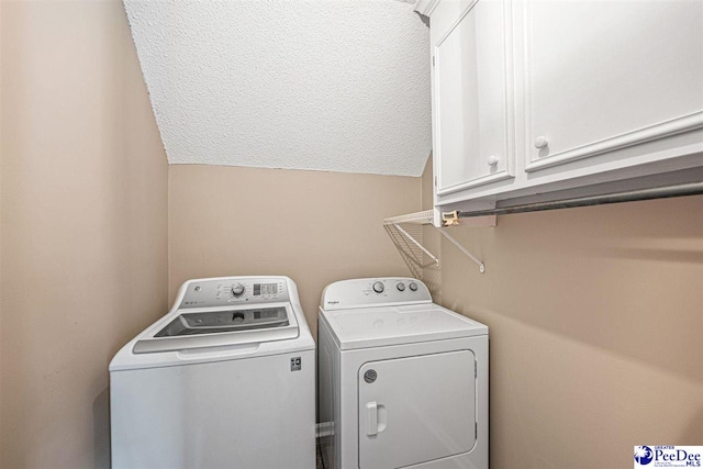 912 Ivanhoe Dr, Florence, SC 29505 - laundry area with cabinet space, washer and dryer, and a textured ceiling