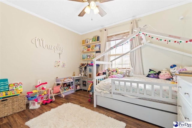 bedroom featuring crown molding, ceiling fan, and wood finished floors