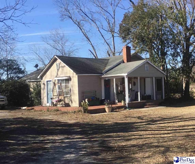 ranch-style home featuring covered porch