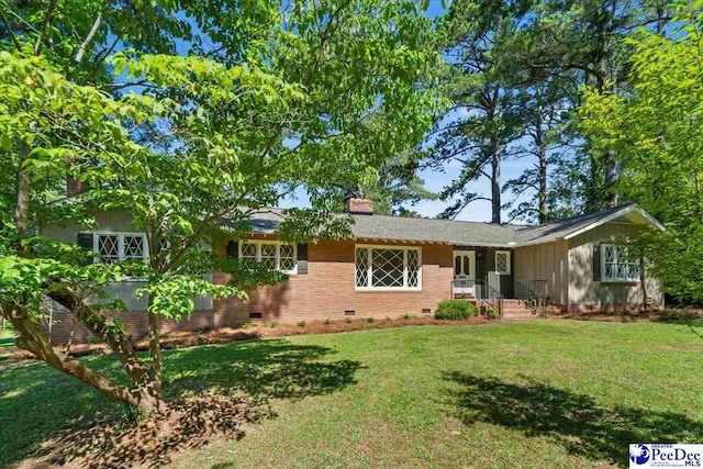 ranch-style home featuring a front yard