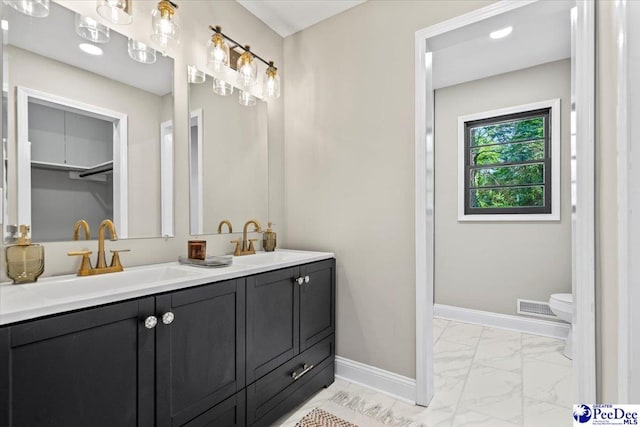 bathroom with vanity and toilet