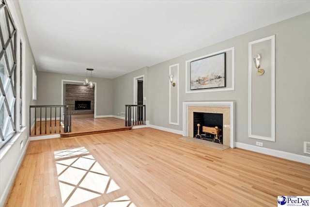 unfurnished living room with wood-type flooring