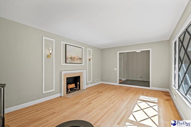 unfurnished living room with light wood-type flooring