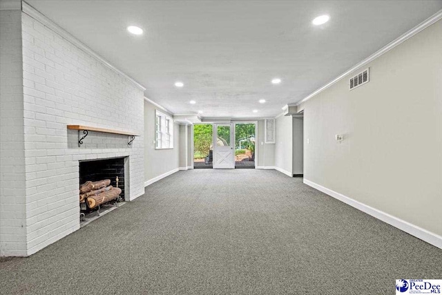 unfurnished living room featuring a fireplace, ornamental molding, and carpet flooring