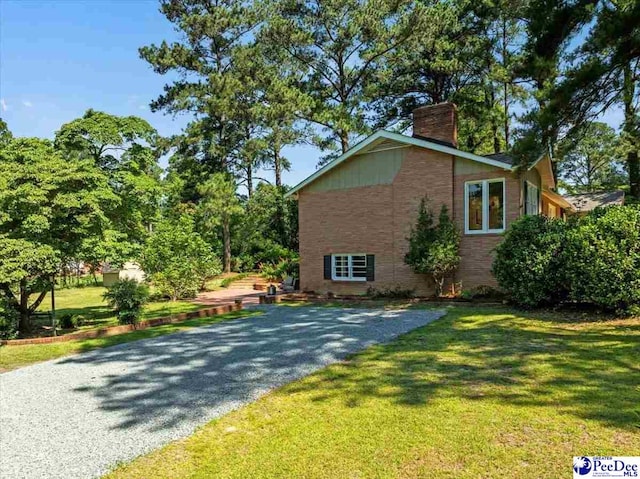 view of home's exterior featuring a lawn