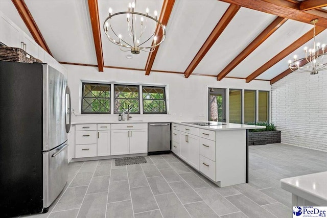 kitchen featuring white cabinetry, a chandelier, hanging light fixtures, kitchen peninsula, and stainless steel appliances