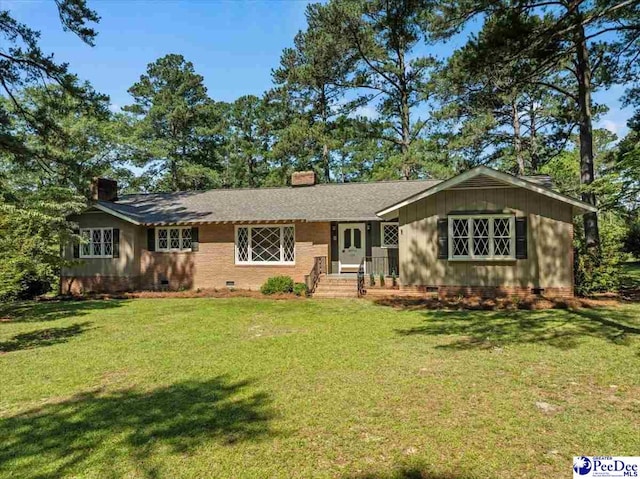 ranch-style house featuring a front yard