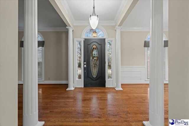 3406 Sussex Ct, Florence, SC 29501 - foyer featuring wood-type flooring, decorative columns, and plenty of natural light