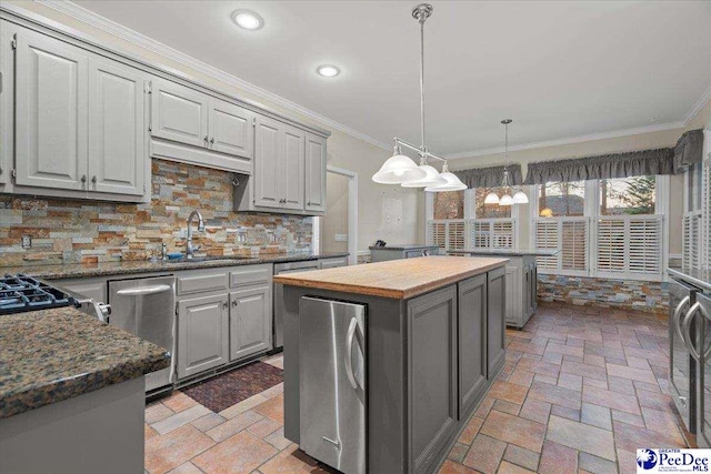 3406 Sussex Ct, Florence, SC 29501 - kitchen with pendant lighting, sink, a kitchen island, and gray cabinetry