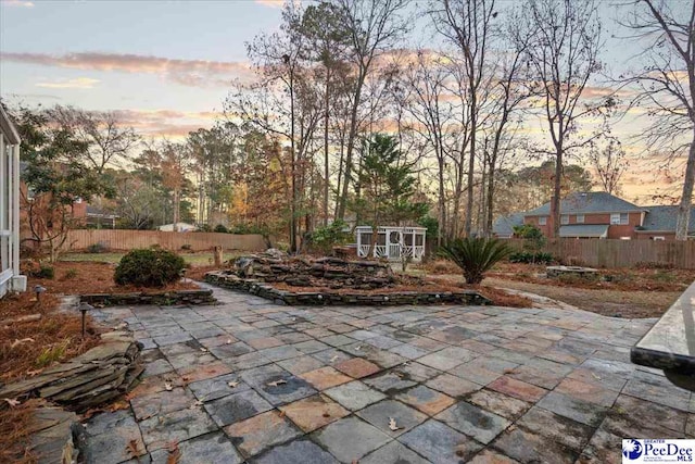 3406 Sussex Ct, Florence, SC 29501 - patio terrace at dusk with a shed