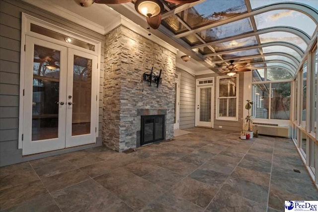 3406 Sussex Ct, Florence, SC 29501 - unfurnished sunroom with french doors, coffered ceiling, beamed ceiling, ceiling fan, and an outdoor stone fireplace