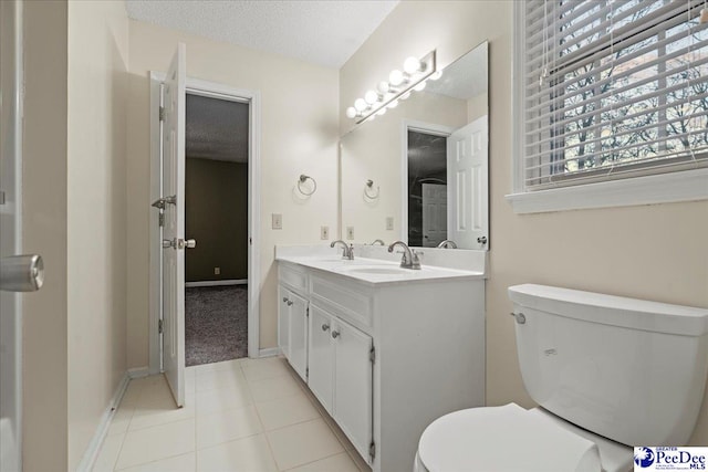3406 Sussex Ct, Florence, SC 29501 - bathroom with vanity, toilet, tile patterned flooring, and a textured ceiling