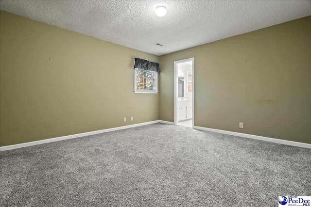 3406 Sussex Ct, Florence, SC 29501 - carpeted empty room with a textured ceiling