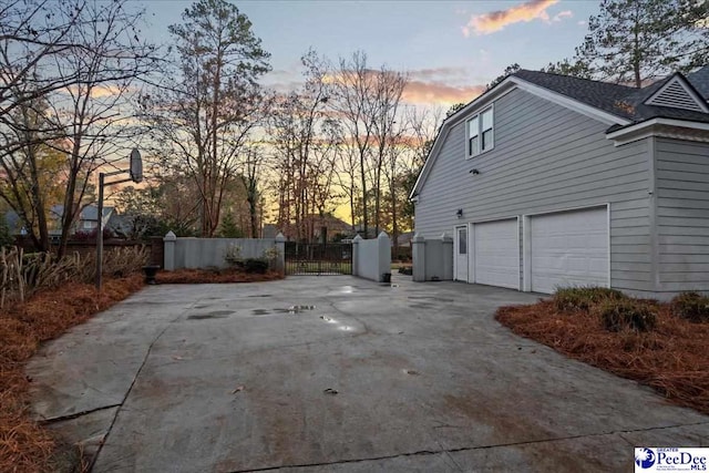3406 Sussex Ct, Florence, SC 29501 - property exterior at dusk with a garage