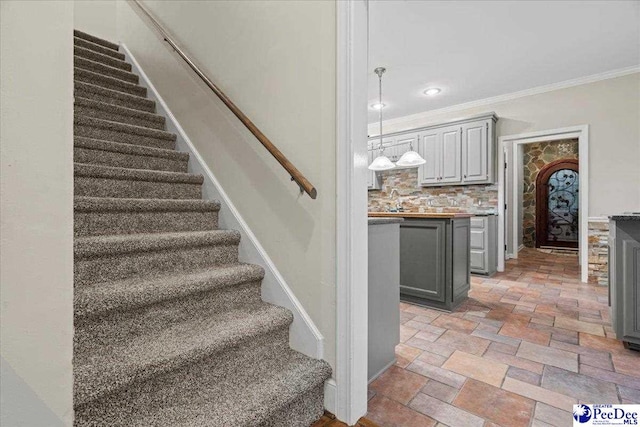 3406 Sussex Ct, Florence, SC 29501 - stairway featuring sink and crown molding