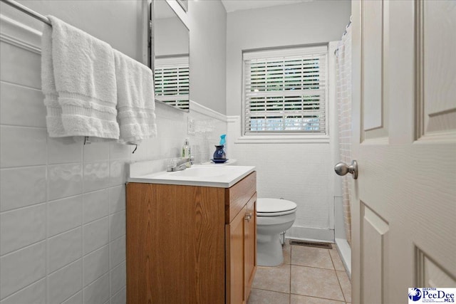 907 Adams Ave, Florence, SC 29501 - full bath with tile walls, toilet, vanity, visible vents, and tile patterned floors