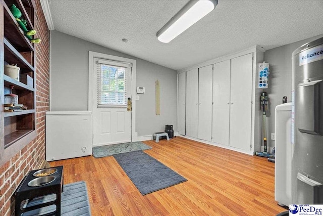907 Adams Ave, Florence, SC 29501 - entrance foyer with lofted ceiling, a textured ceiling, and light wood-style floors