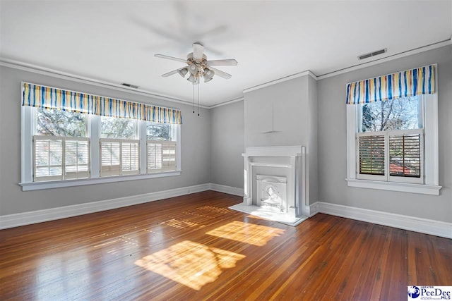 unfurnished living room featuring hardwood / wood-style flooring, ornamental molding, and ceiling fan