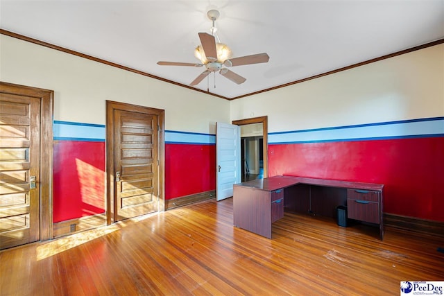 unfurnished office featuring hardwood / wood-style flooring, ornamental molding, and ceiling fan