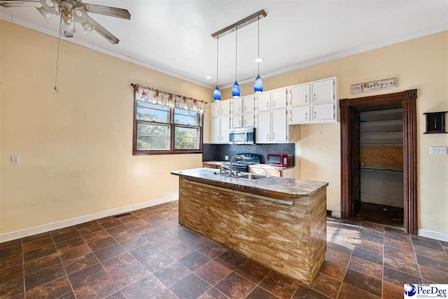 kitchen with sink, hanging light fixtures, ornamental molding, white cabinets, and decorative backsplash