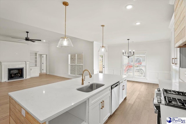 4064 Crest Cv, Florence, SC 29501 - kitchen with stainless steel appliances, an island with sink, a sink, and pendant lighting