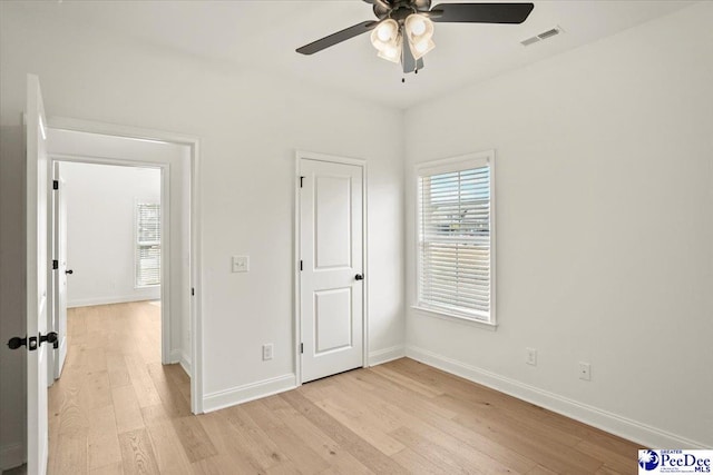 4064 Crest Cv, Florence, SC 29501 - unfurnished bedroom featuring light wood finished floors, a ceiling fan, visible vents, and baseboards