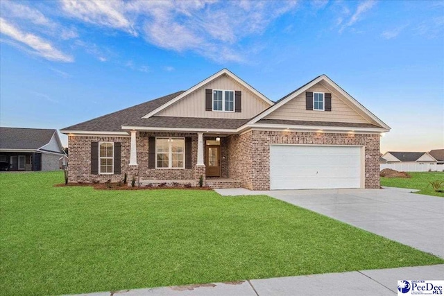 craftsman-style home with a garage, driveway, brick siding, and a front yard