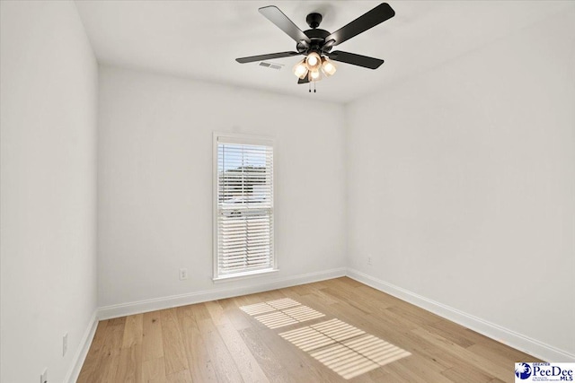 4064 Crest Cv, Florence, SC 29501 - empty room with a ceiling fan, light wood-style flooring, visible vents, and baseboards