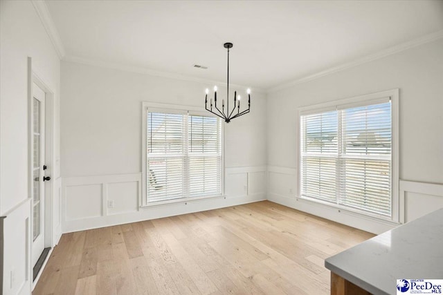 4064 Crest Cv, Florence, SC 29501 - unfurnished dining area with light wood-style floors, visible vents, a wealth of natural light, and ornamental molding