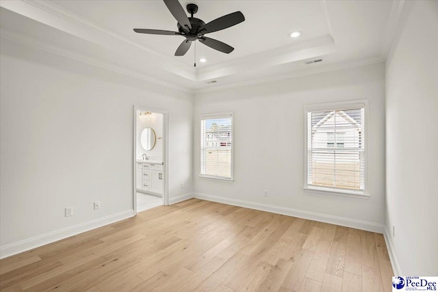 4064 Crest Cv, Florence, SC 29501 - unfurnished room featuring light wood-type flooring, baseboards, a tray ceiling, and crown molding