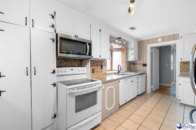 23 Mcrae Rd, Cheraw, SC 29520 - kitchen featuring white appliances, white cabinetry, tasteful backsplash, light tile patterned floors, and crown molding
