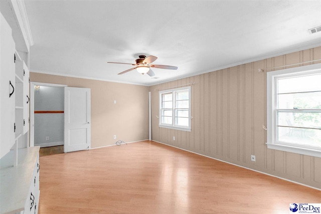 23 Mcrae Rd, Cheraw, SC 29520 - empty room featuring light wood-style flooring, ceiling fan, and crown molding