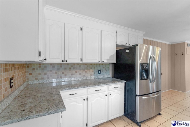 23 Mcrae Rd, Cheraw, SC 29520 - kitchen featuring stainless steel fridge, white cabinets, backsplash, and light tile patterned flooring